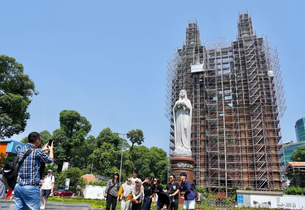 You can take photos in front of the church, where the iconic statue of Our Lady of Peace stands